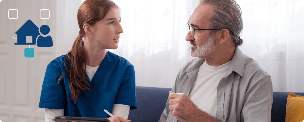 Nurse holding tablet taking to older man and icon for home healthcare