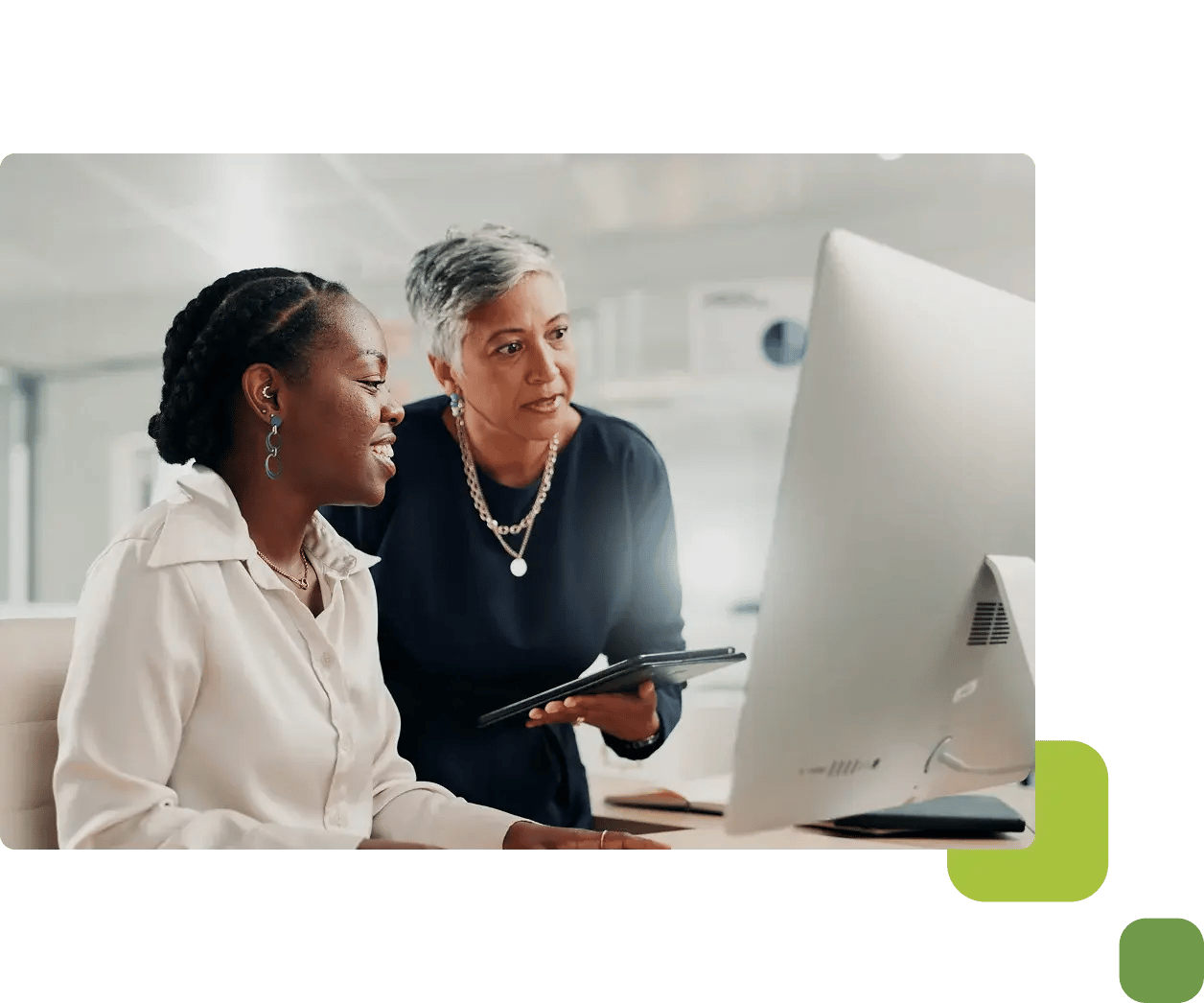 two women on computer and tablet
